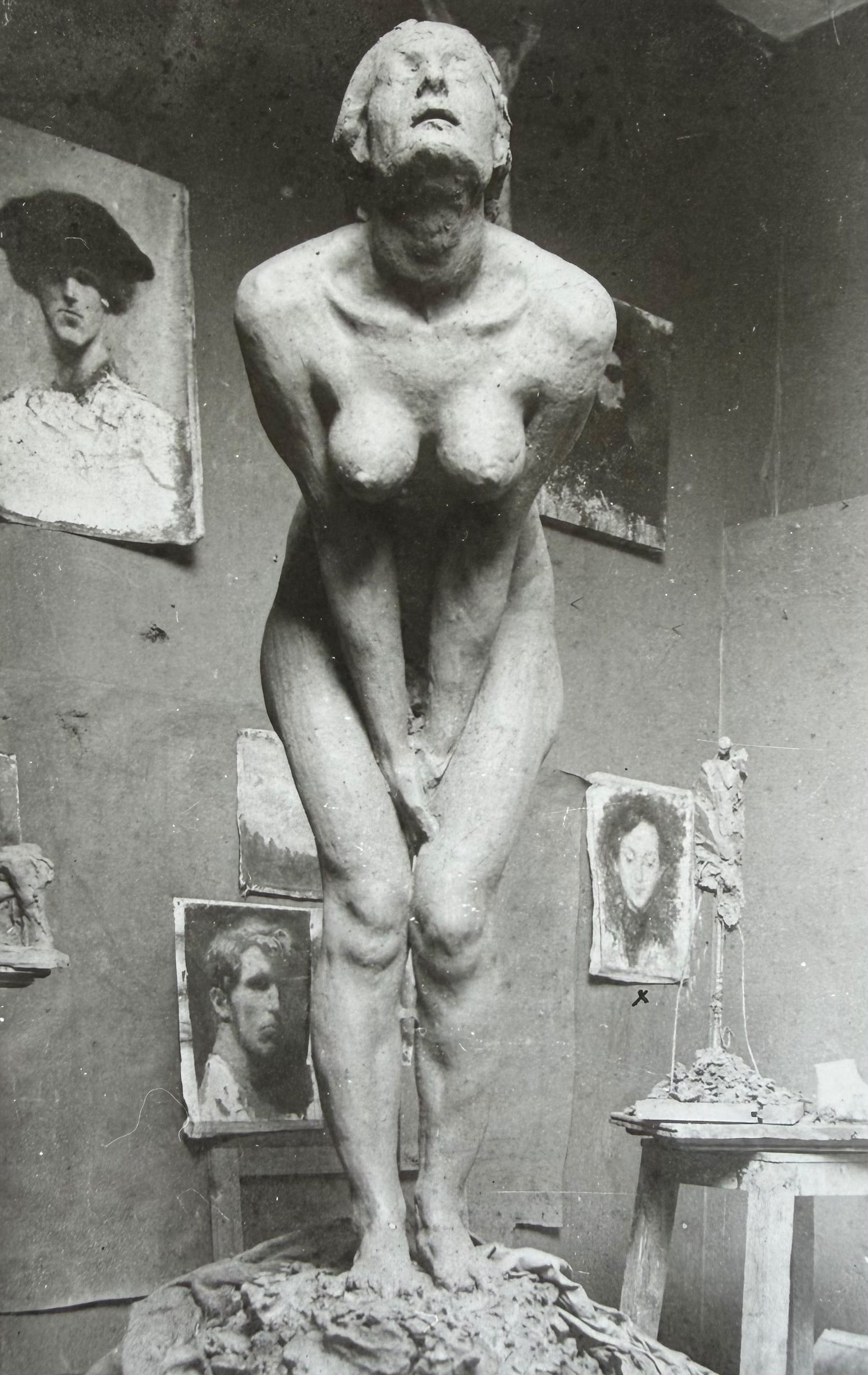 Large plaster figure of a standing woman in the artist's studio